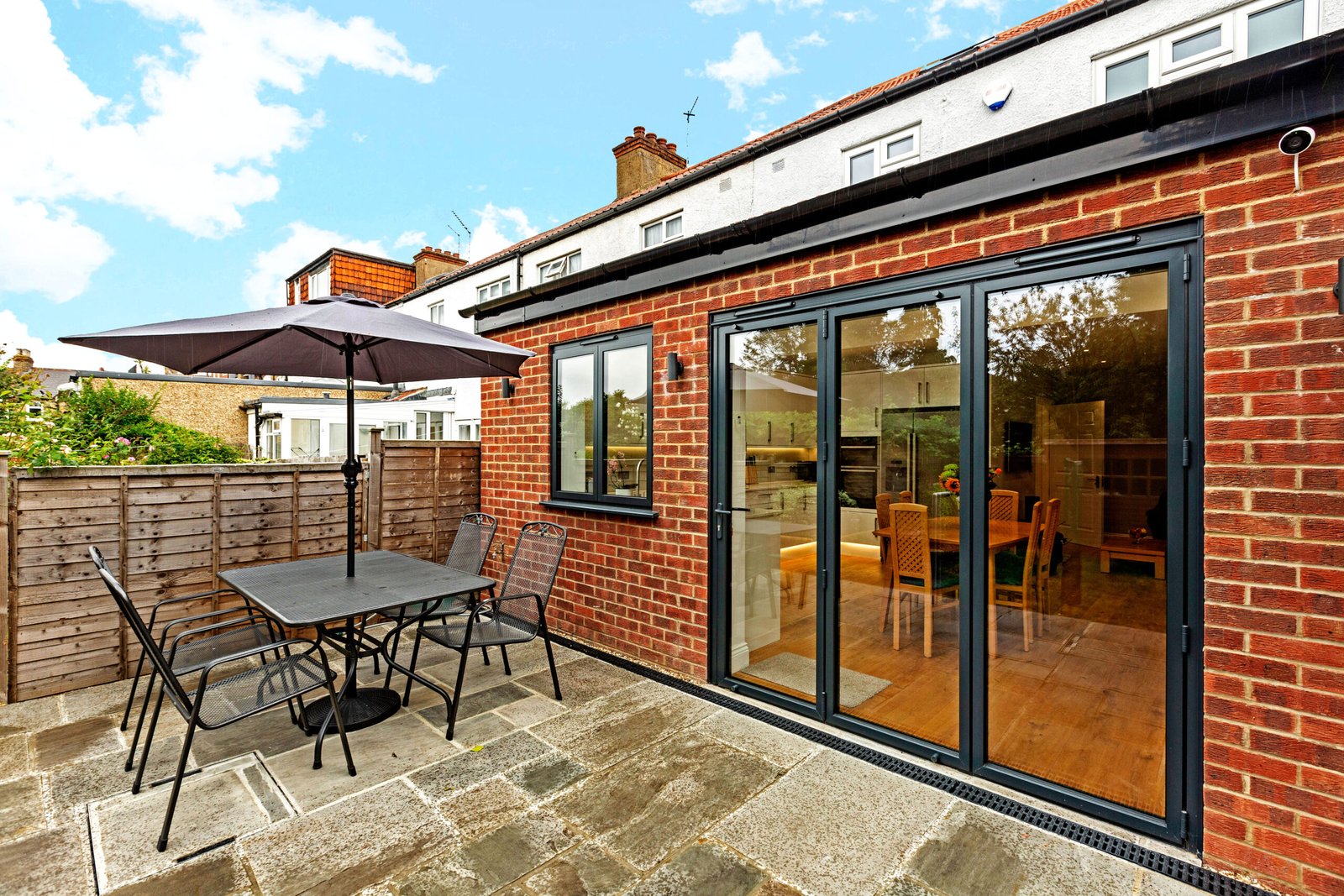 Sliding Door Seamlessly Connects to Spacious Living Space - London Renovation and Extension Service