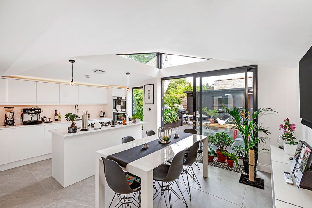 Kitchen and TV room, where we cook, dine, and relax with entertainment, fostering family togetherness.