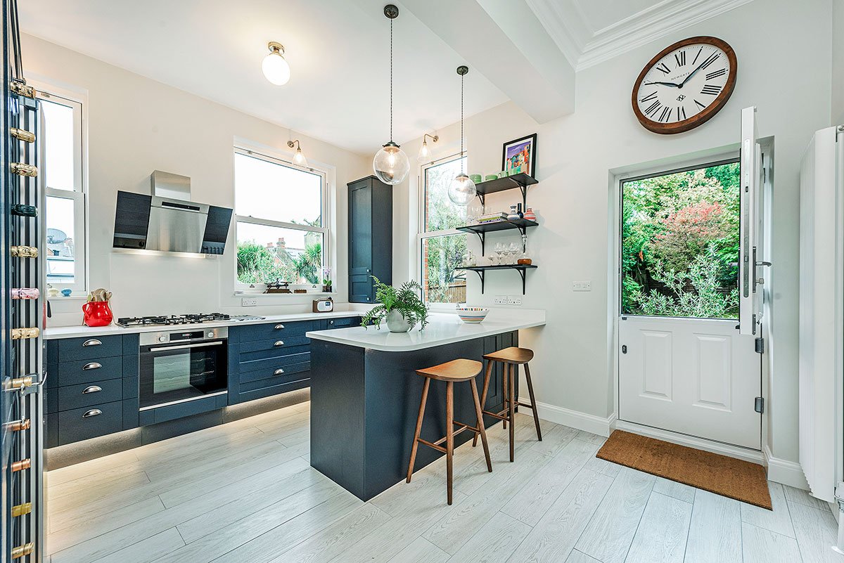 Revamp your kitchen with stunning white tile installation for a timeless, elegant look